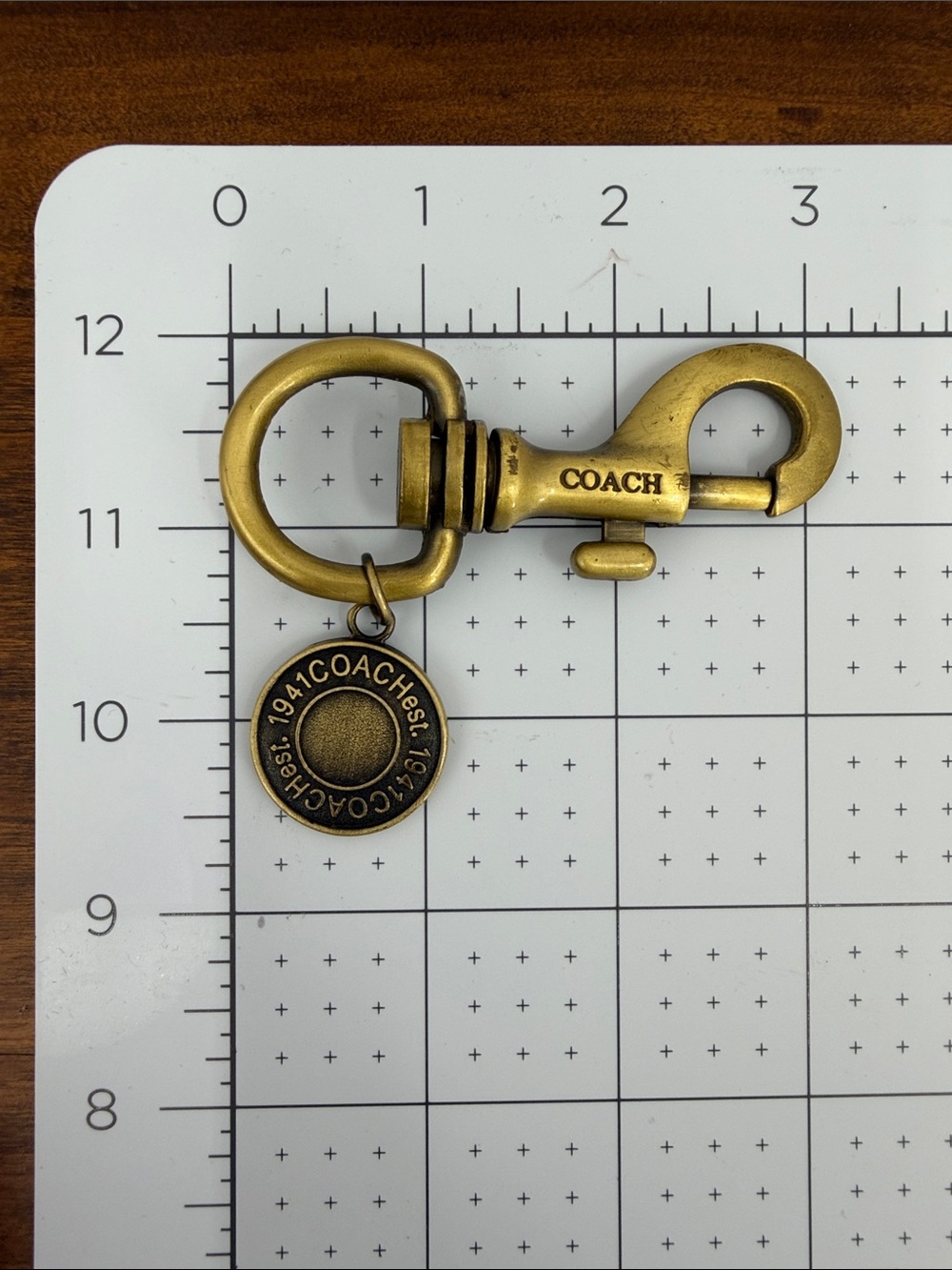 COACH Antique Brass Key Clip with Round Logo Charm - Brass - Picture 5 of 5